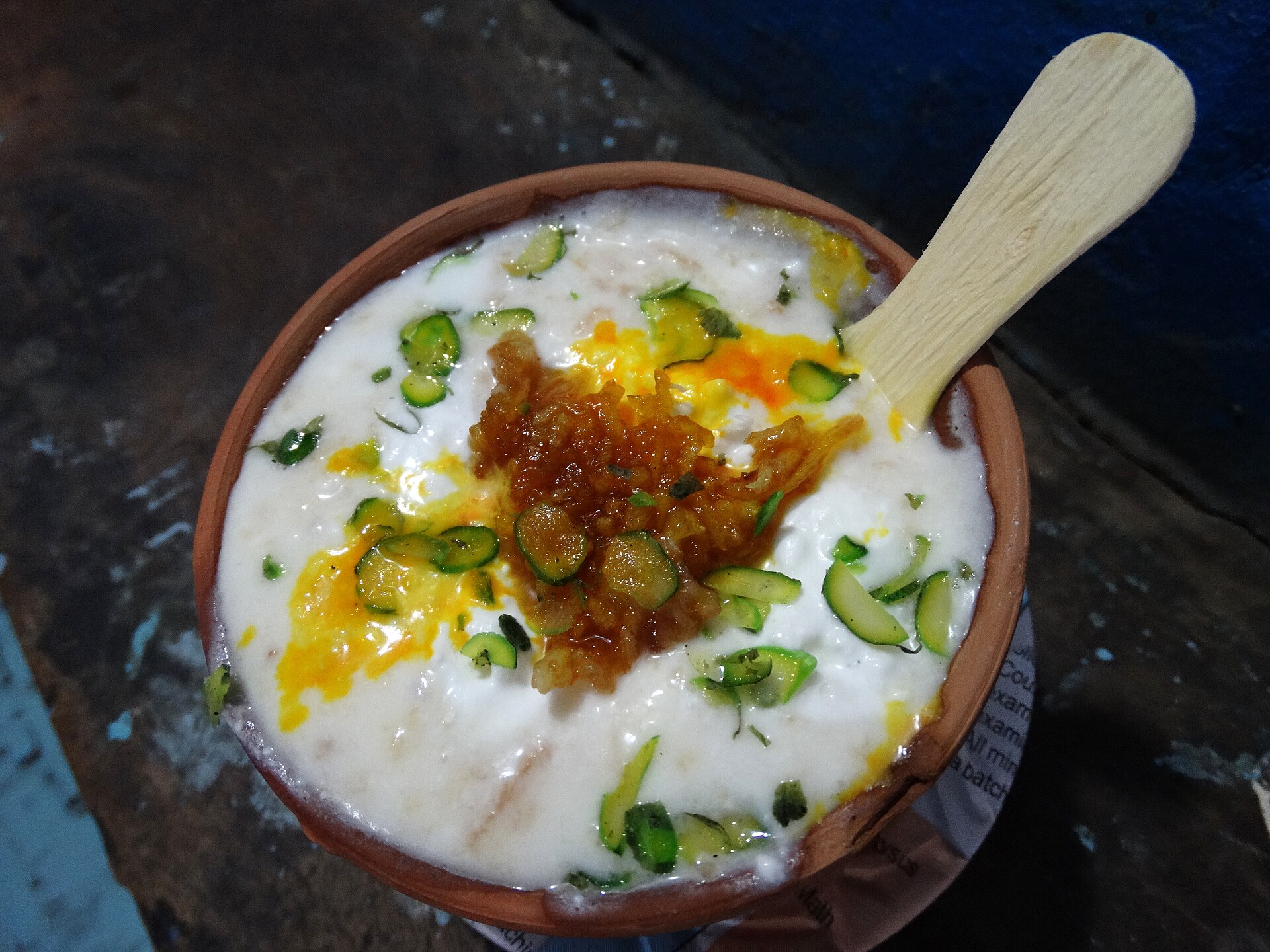 A clay cup of lassi topped with saffron and pistachio at Blue Lassi in Varanasi's old city
