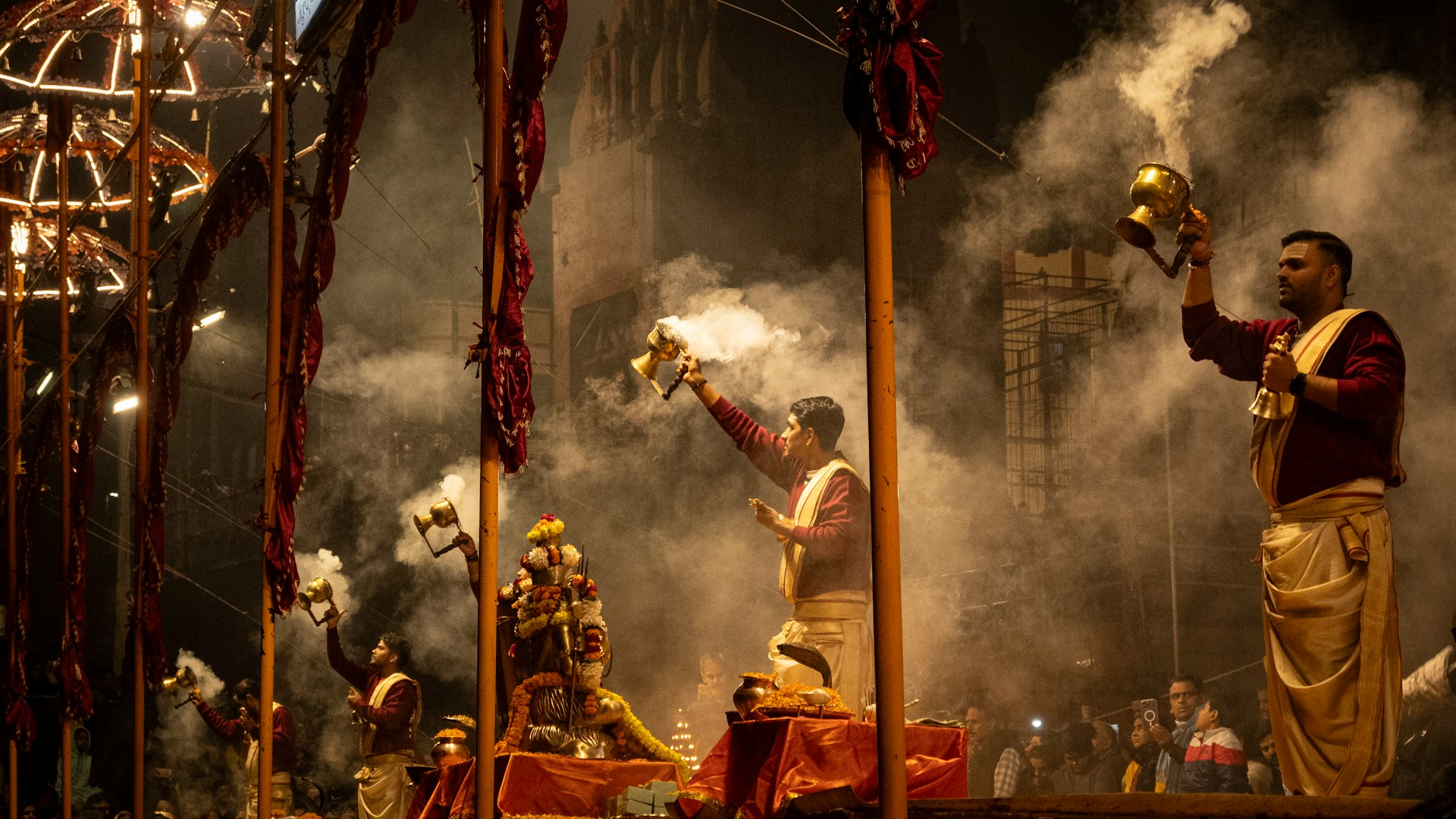 Varanasi — ghat steps at dawn, wet stone, boats beyond